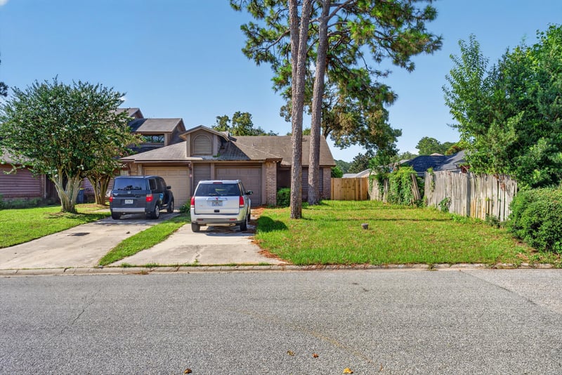 Front exterior and driveway view at 8010 International Village Dr, Jacksonville, FL 32277