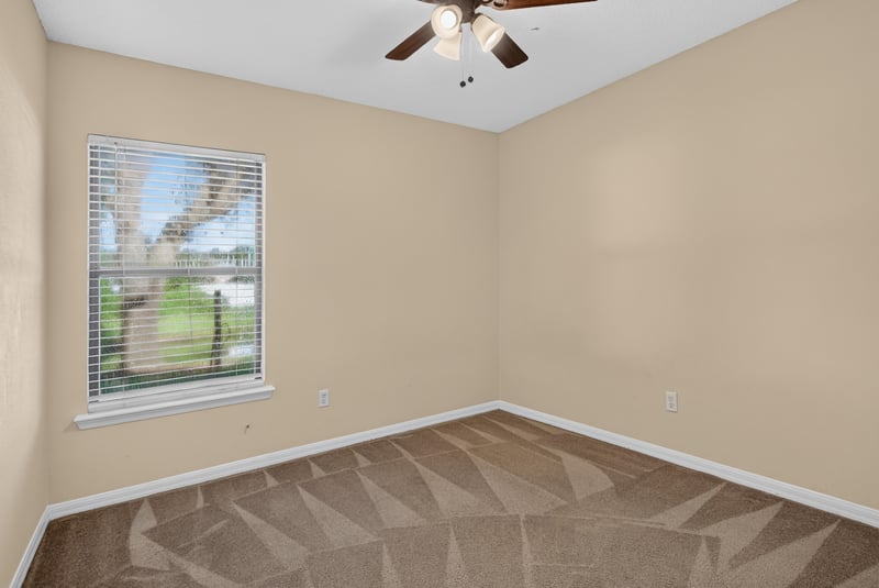 Empty bedroom with carpet and window light at 353 Redwood Ln
