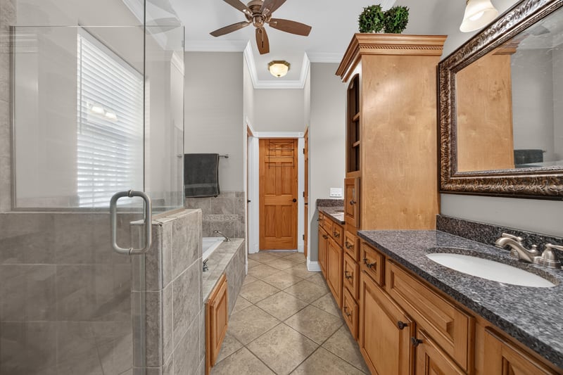 Primary bath vanity with tile floor at 1735 Hagans Ridge Ct