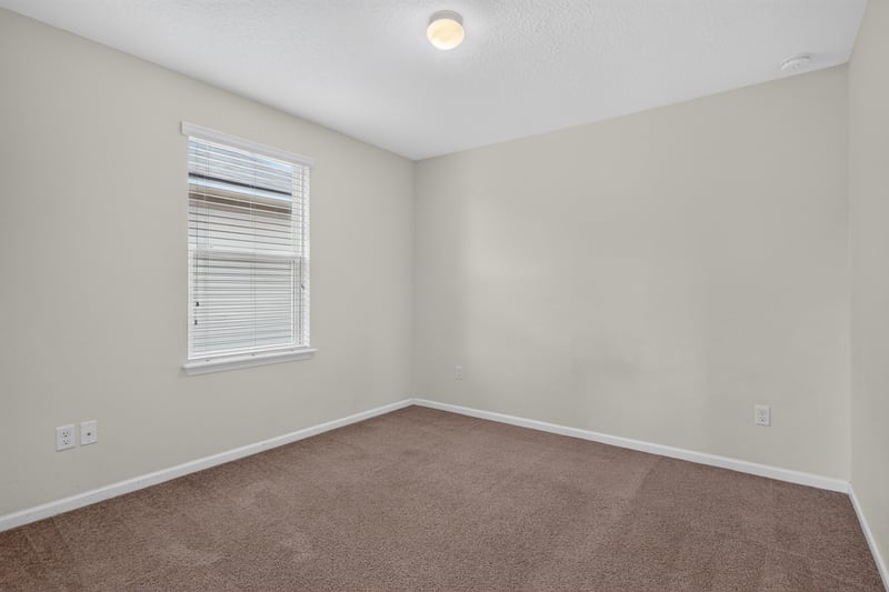 Bedroom with carpet and window at 263 Gilmore Ln, Orange Park, FL 32065