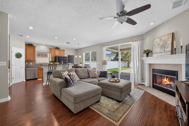 Great room with fireplace open to the kitchen at 3660 Middlebrook Dr, Orange Park, FL 32065