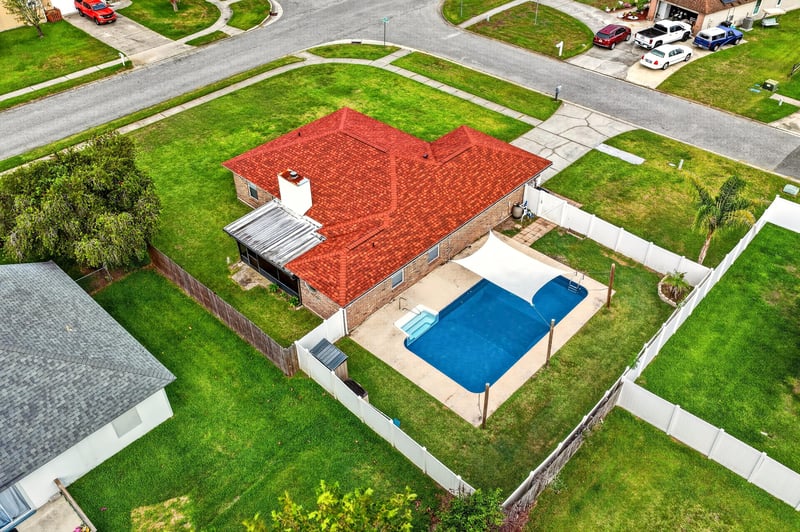 Aerial view of the home, pool, and street at 2164 Orangewood St, Middleburg, FL 32068