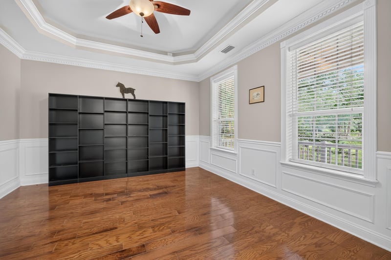 Living room with built-in cabinetry and hardwood floors at 1735 Hagans Ridge Ct