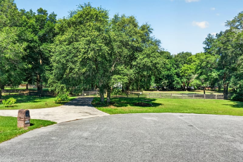 Paved driveway with lawn and trees at 1735 Hagans Ridge Ct