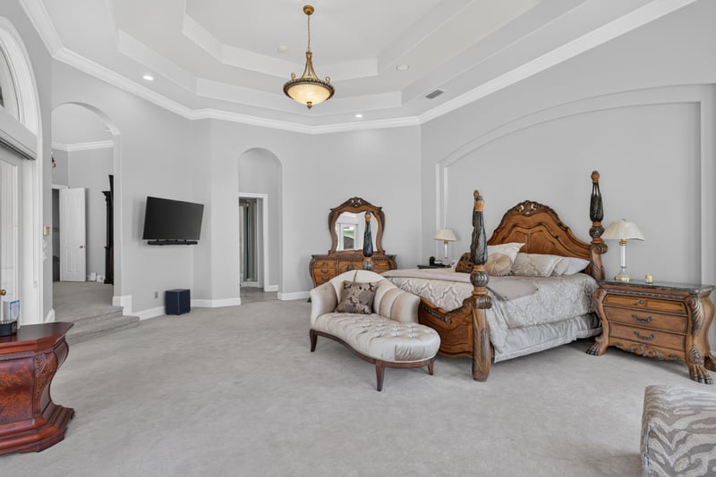 Primary bedroom with tray ceiling and TV wall at 344 Broward Rd, Jacksonville, FL