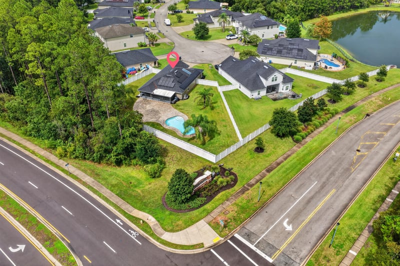 Aerial view of road and surrounding homes in St. Johns, FL