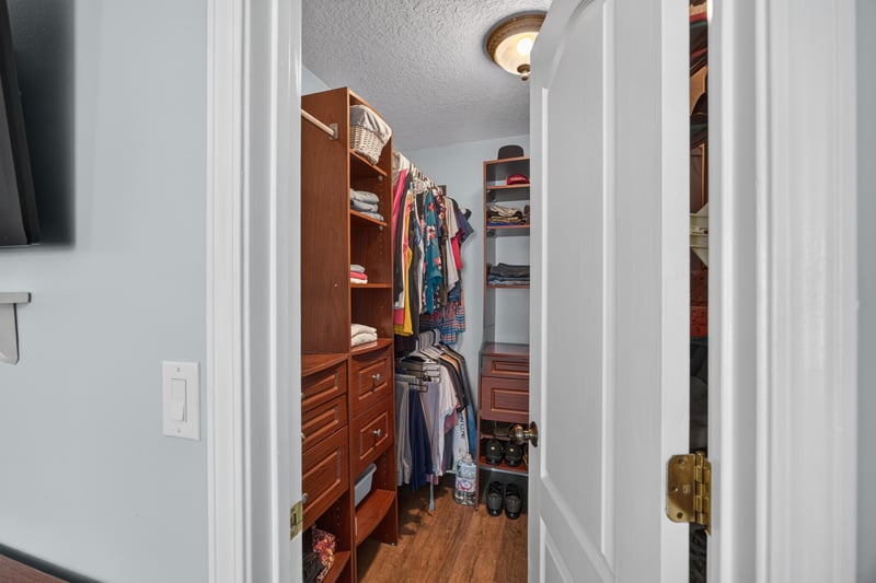 Walk-in closet with shelving at 1589 Backwater Drive, Middleburg, FL 32068
