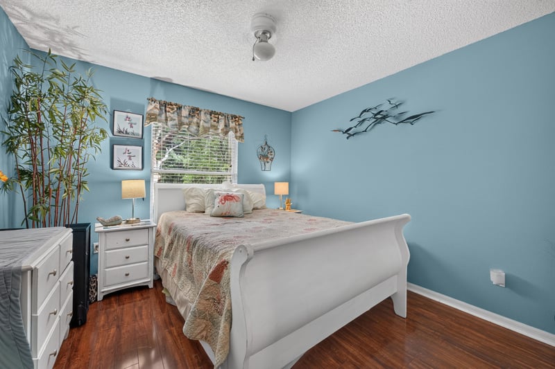 Bedroom with white furniture and blue walls at 145 Dover Bluff Dr, Orange Park, FL