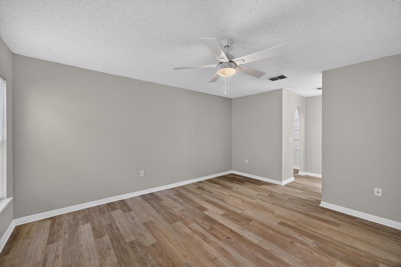 Bedroom with ceiling fan and closet door at 1845 Saga Ct, Middleburg, FL
