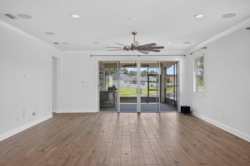 Living and dining area with sliding glass doors at 855 Flach Dr, St. Johns, FL