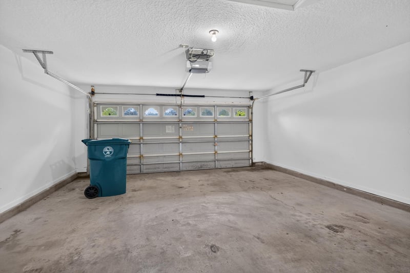 Garage interior with carriage-style door at 11669 Collins Creek Dr, Jacksonville, FL 32258
