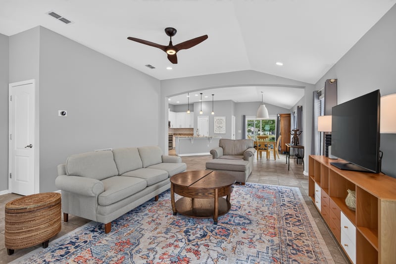 Living room with area rug and ceiling fan at 85 Amia Dr, St. Augustine, FL 32086