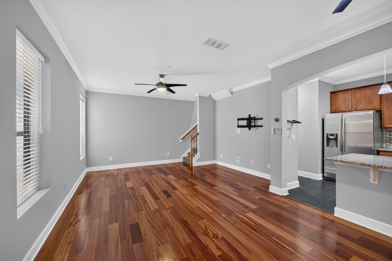 Upstairs landing with wood and carpet flooring at 6217 Eclipse Cir, Jacksonville, FL 32258