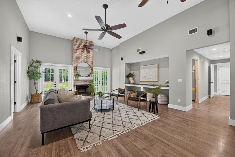Living room with fireplace and dining area beyond at 1161 Whispering Pines Rd, Jacksonville, FL 32259