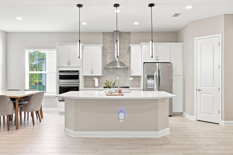 Kitchen island with pendant lighting and stainless appliances at 27 Holly Rdg Wy, St. Augustine, FL