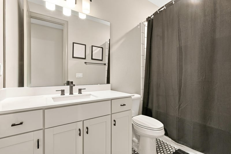 Bathroom vanity with shower-tub combo at 3921 Spyglass Hill Ln