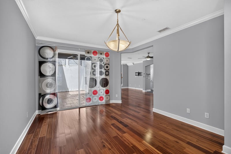 Entry hallway with wood flooring and staircase at 6217 Eclipse Cir, Jacksonville, FL 32258