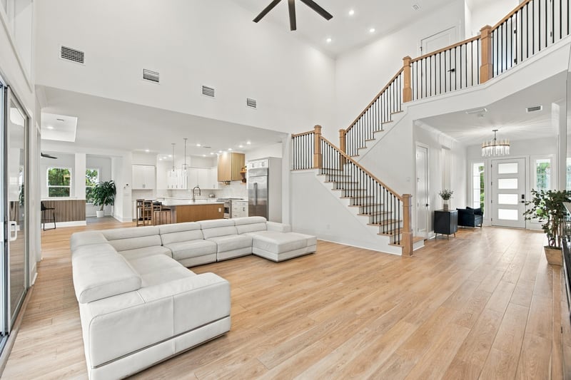 Great room with staircase and open floor plan at 907 Seagrove Dr, Ponte Vedra Beach, FL 32081