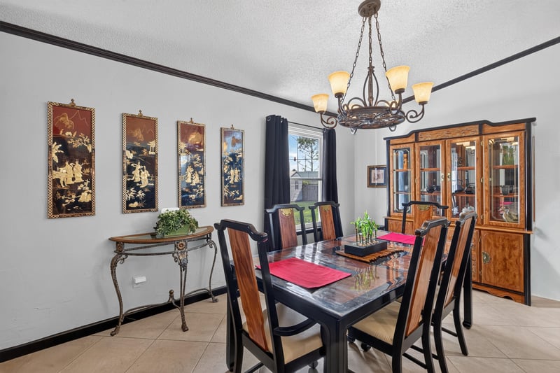Dining area with chandelier and hutch at 6931 Cane Grass Ln E, Jacksonville, FL 32244