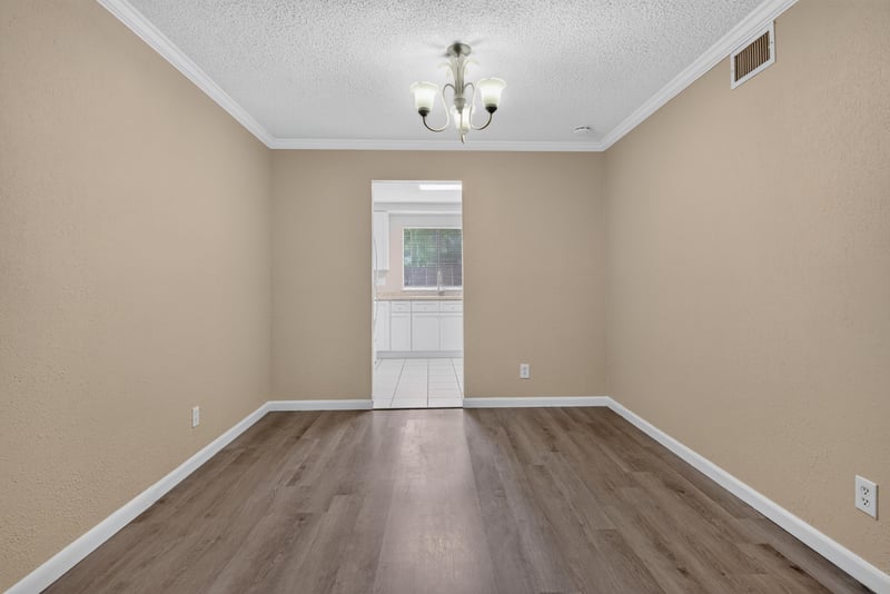 Empty dining area with chandelier at 5811 Atlantic Blvd unit 47, Jacksonville, FL 32207