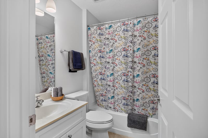Hall bathroom with patterned shower curtain at 11225 Water Spring Cir, Jacksonville, FL 32256