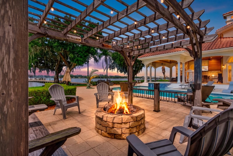 Fire pit seating under a pergola at day-to-dusk at 344 Broward Rd, Jacksonville, FL