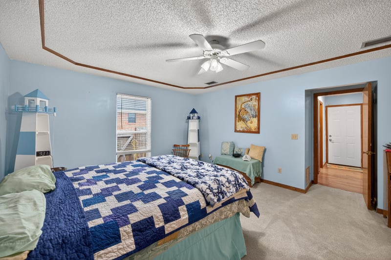 Bedroom with lighthouse decor and ceiling fan at 981 Marble Ridge Dr, Orange Park, FL 32065