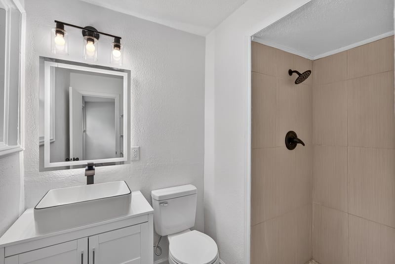 Bathroom with walk-in shower and vanity at 3113 Kline Rd, Jacksonville, FL 32246