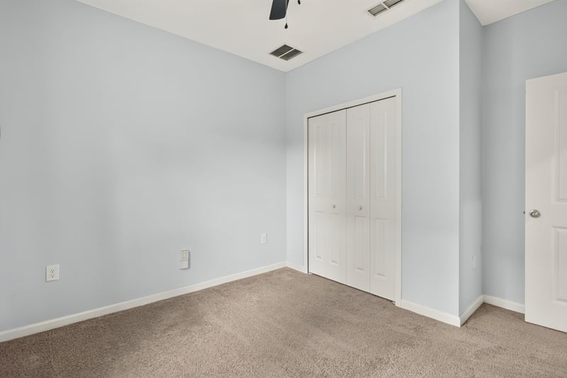 Carpeted room with closet door at 2378 Caney Oaks Dr, Jacksonville, FL