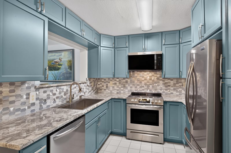 Kitchen with microwave and refrigerator at 10150 Belle Rive Blvd, Jacksonville, FL