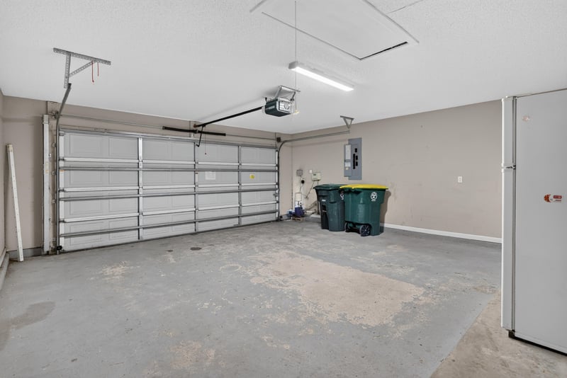 Garage interior with overhead door at 12949 Chets Creek Dr S, Jacksonville, FL 32224