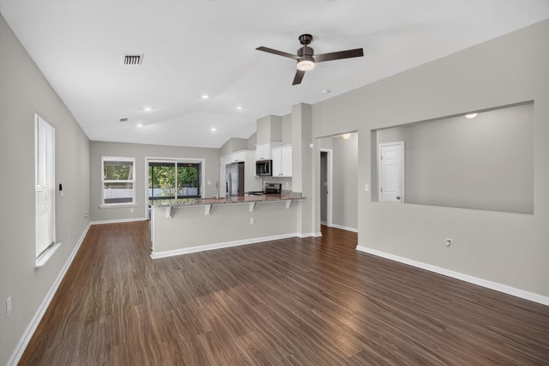Living room open to kitchen at 7118 Preston Pnes Trl, Jacksonville, FL