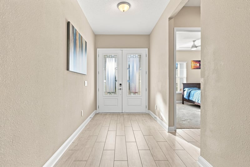 Foyer with double entry doors and tile flooring at 27 Holly Rdg Wy, St. Augustine, FL