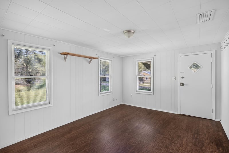 Living room with front door and windows at 2372 2nd Ave, Jacksonville, FL 32208