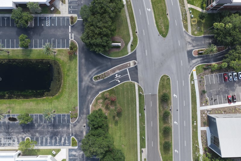 Aerial view of a street intersection and parking lots at 10550 Deerwood Park Blvd, Jacksonville, FL 32256