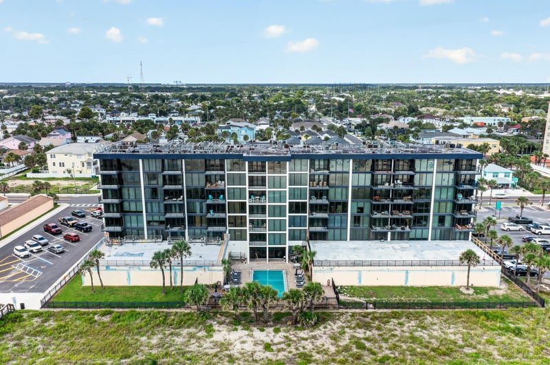 Aerial side view of the oceanfront building at 601 1st St S, Jacksonville Beach