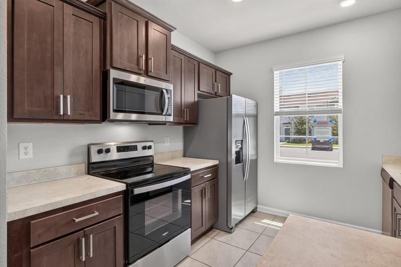 Kitchen with stainless range and tile backsplash at 2837 Black Buck Cir, Jacksonville, FL 32225