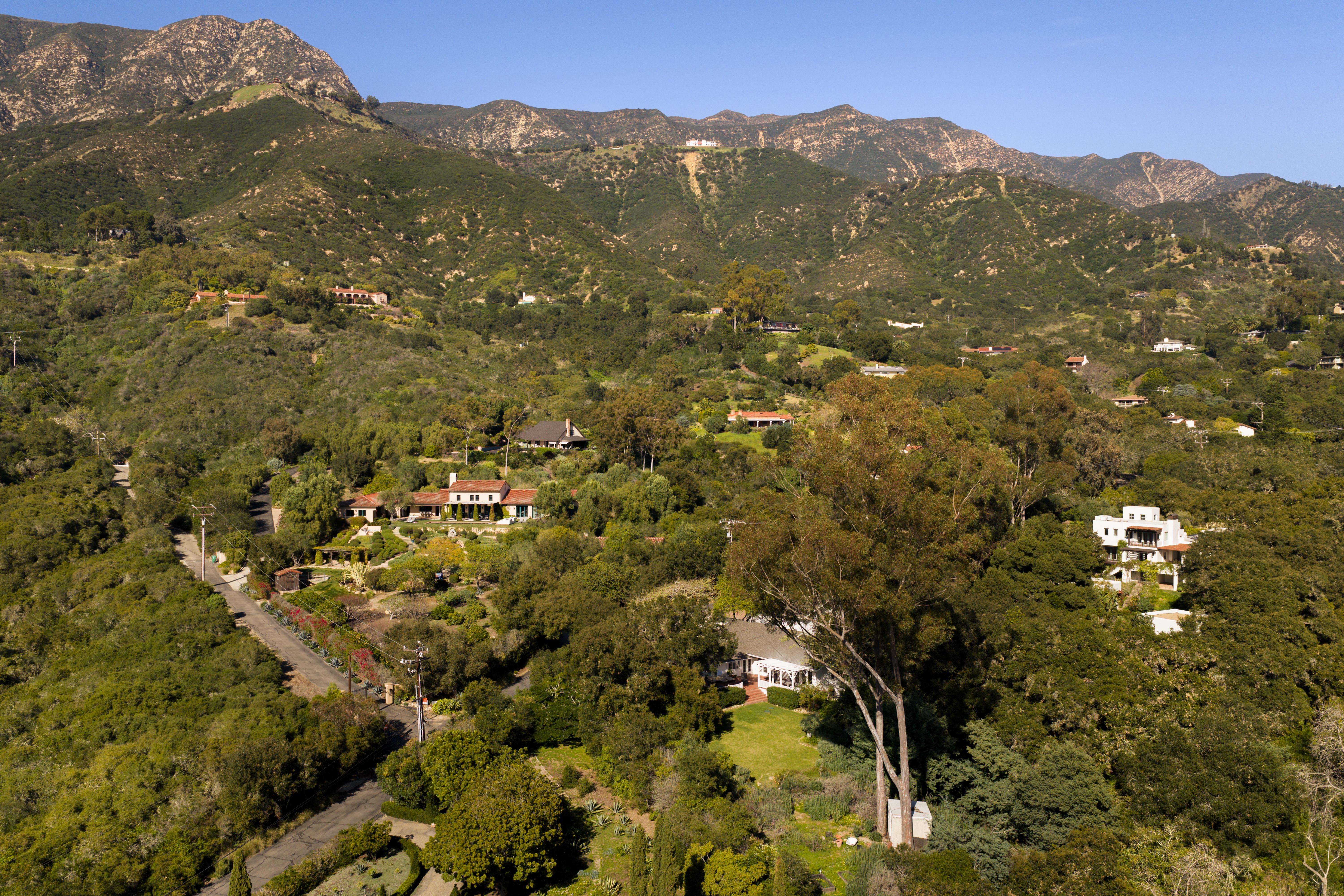 Professional real estate photography of the primary suite and private outdoor spaces at 2915 Hidden Valley Ln, Santa Barbara — golden hour illuminates the interplay of indoor and outdoor living along the Santa Barbara Riviera. Our team captured still photography, aerial drone photography, and twilight photography from late afternoon through twilight.