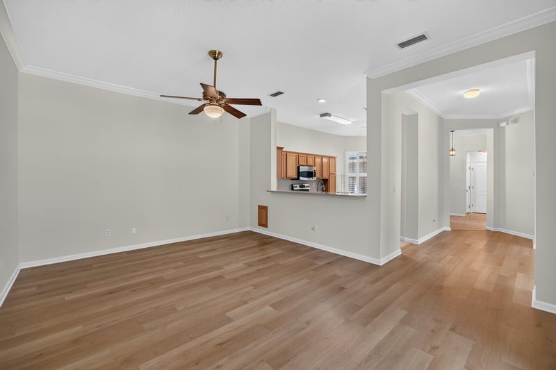 Kitchen view from living area with wood floors at 2131 E Stone Creek Dr, Fleming Island, FL