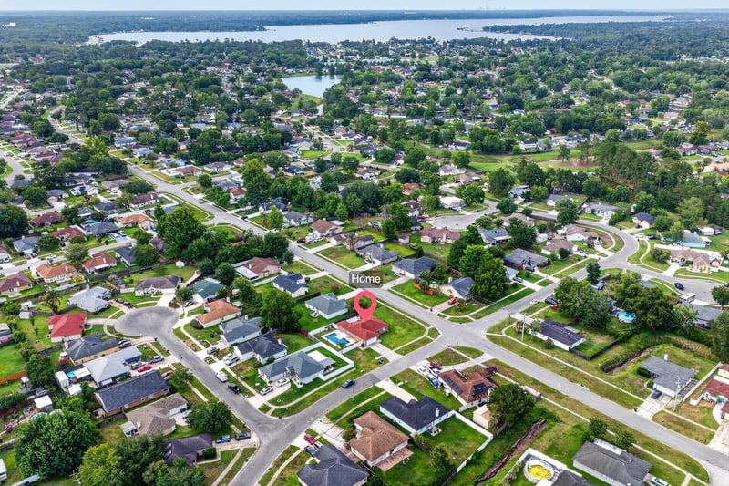 Aerial view of rooftops and distant water in Middleburg, FL