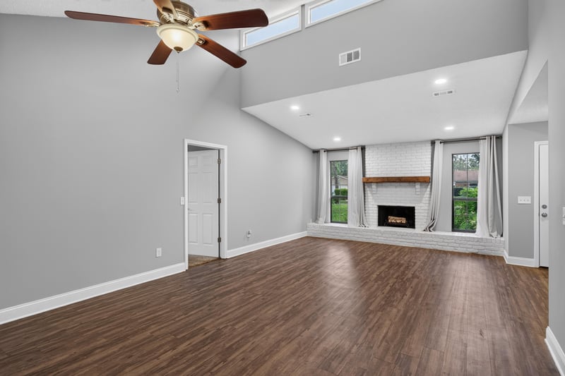 Living room with fireplace and wood floors at 12344 Cormorant Ct, Jacksonville, FL