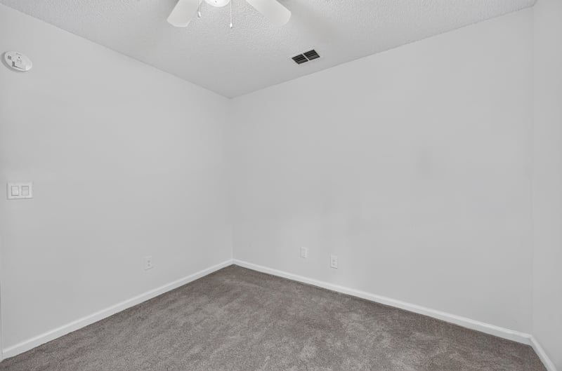 Empty carpeted room with window at 8921 Needlepoint Pl, Jacksonville, FL 32244
