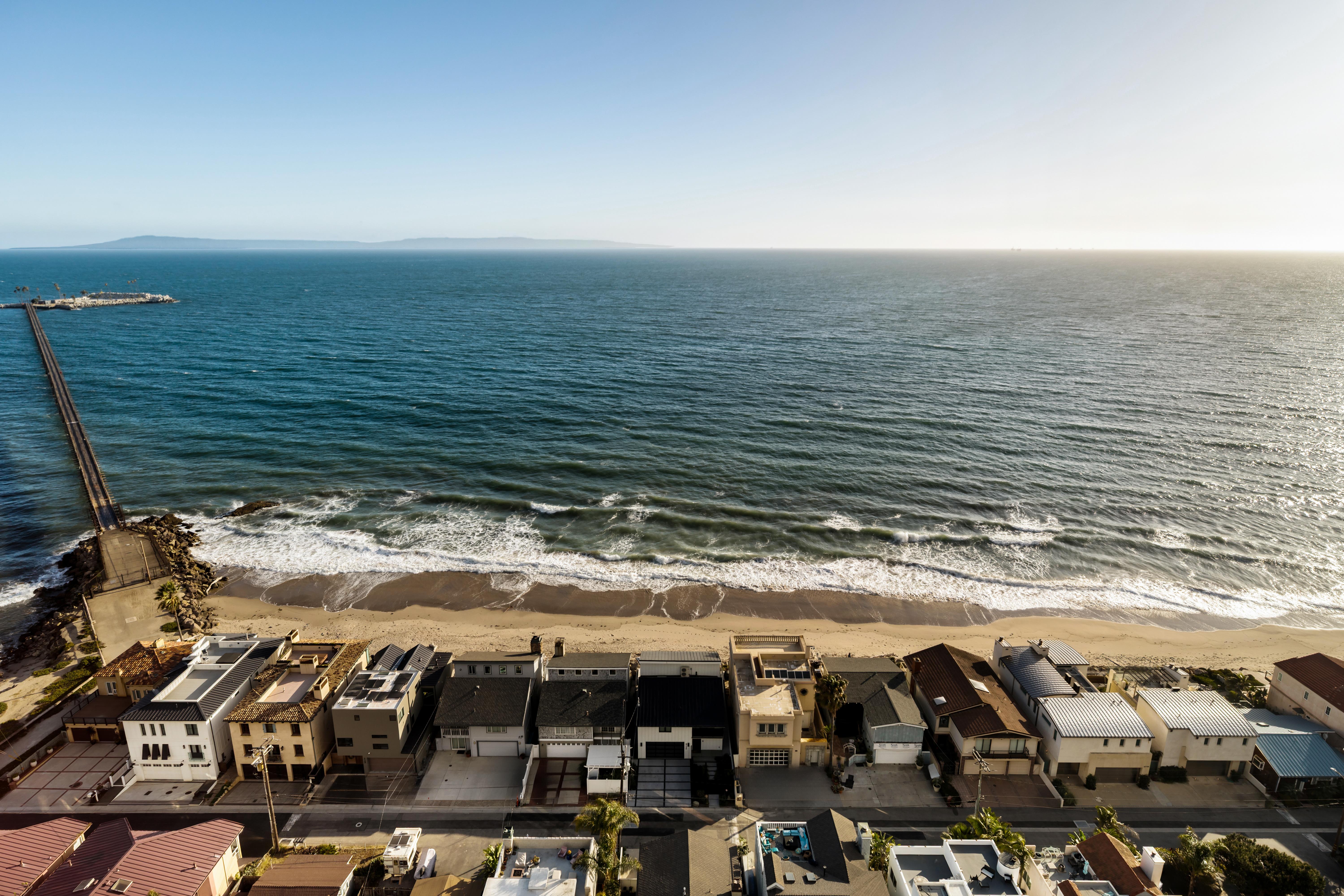 Aerial drone photography above 6726 Breakers Way, Ventura — cinematic Inspire 3 footage traces the Pacific shoreline south toward Carpinteria bluffs, capturing the full coastal context of this exceptional property. Our team captured still photography, aerial drone photography with Inspire 3 Cinema Drone, FPV clips, a cinematic property video with agent narration, a Matterport virtual tour, a Zillow Showcase, a true vertical social media reel, and floor plan scan throughout the early morning.