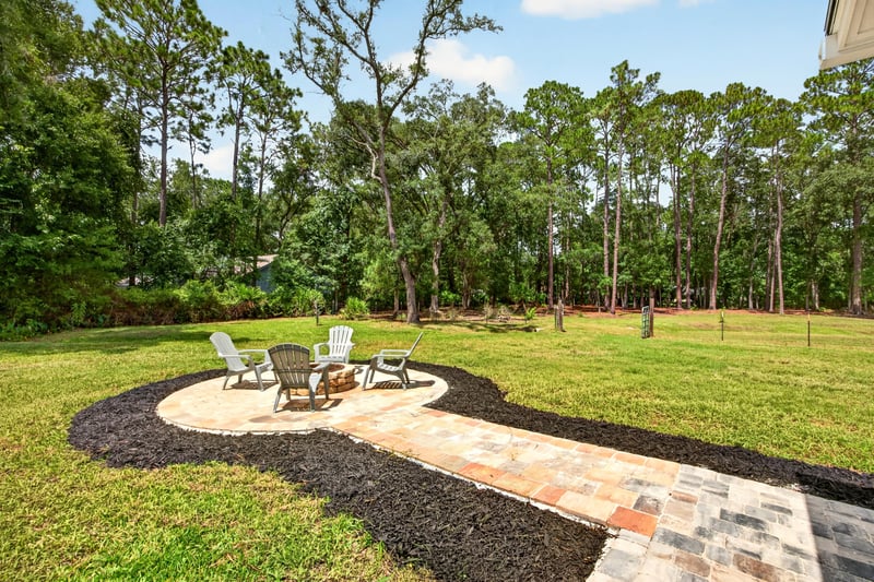 Fire pit area with pathway through trees at 1161 Whispering Pines Rd, Jacksonville, FL 32259