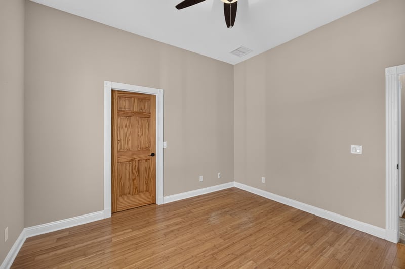Hallway with wood doors and hardwood floors at 1735 Hagans Ridge Ct