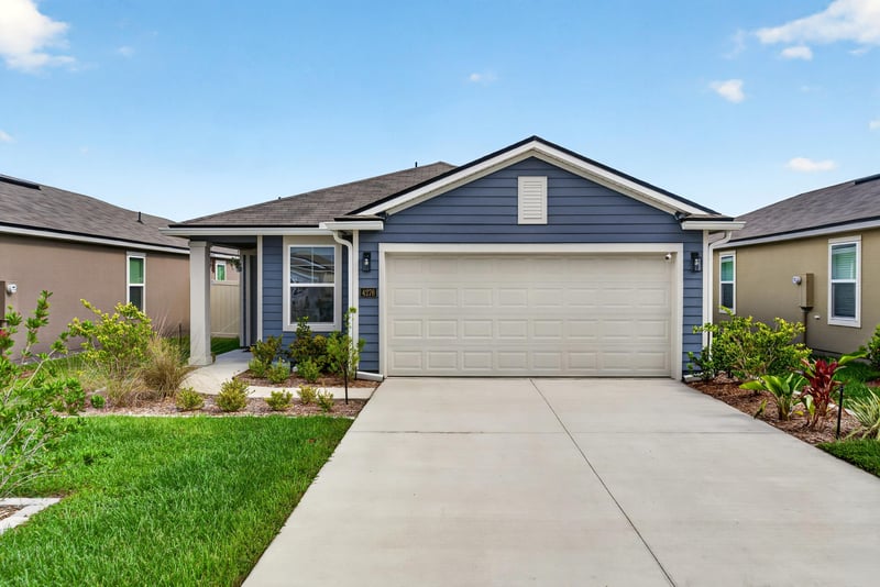 Front exterior with sidewalk and landscaping at 4276 Quaking St, Jacksonville, FL 32218