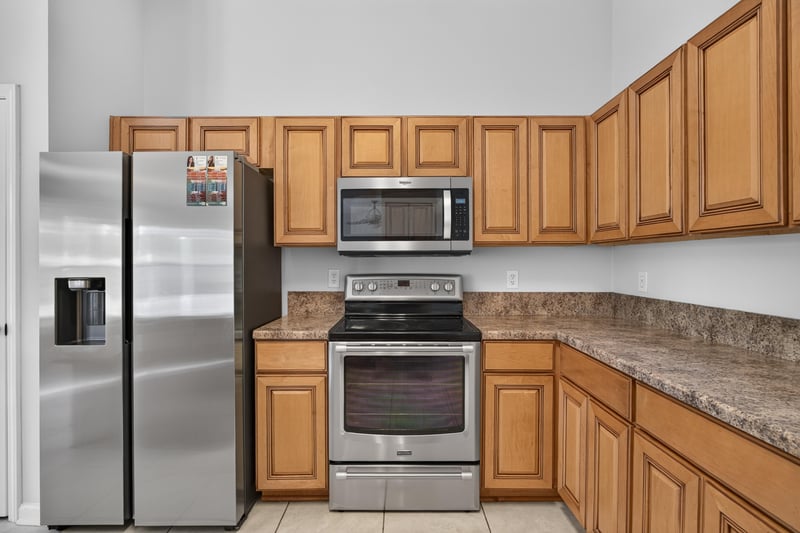 Kitchen with stainless appliances and granite counters at 456 Bay Point Way N, Jacksonville, FL 32259