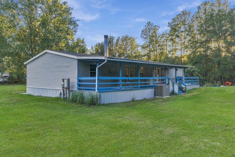 Exterior with covered porch, photographed by Megapixeler on Secret Cove Rd, Middleburg, FL