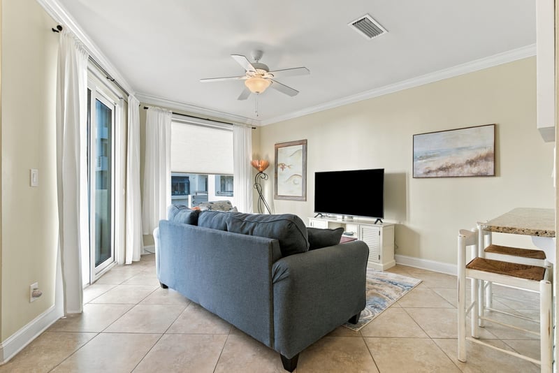 Living room with sofa, TV and ceiling fan at 805 Spinnakers Reach Dr, Ponte Vedra Beach, FL 32082