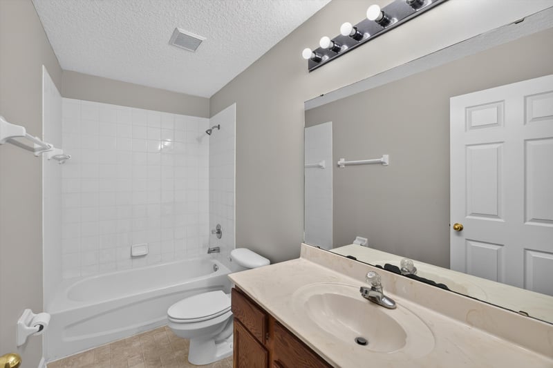 Bathroom with tub-shower combo and vanity at 14147 Fish Eagle Dr E, Jacksonville, FL 32226